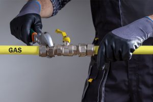 plumber working on gas line